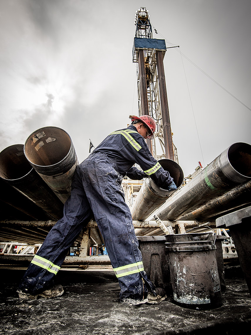 Cleaning Pipes at Oil Drilling Rig Site