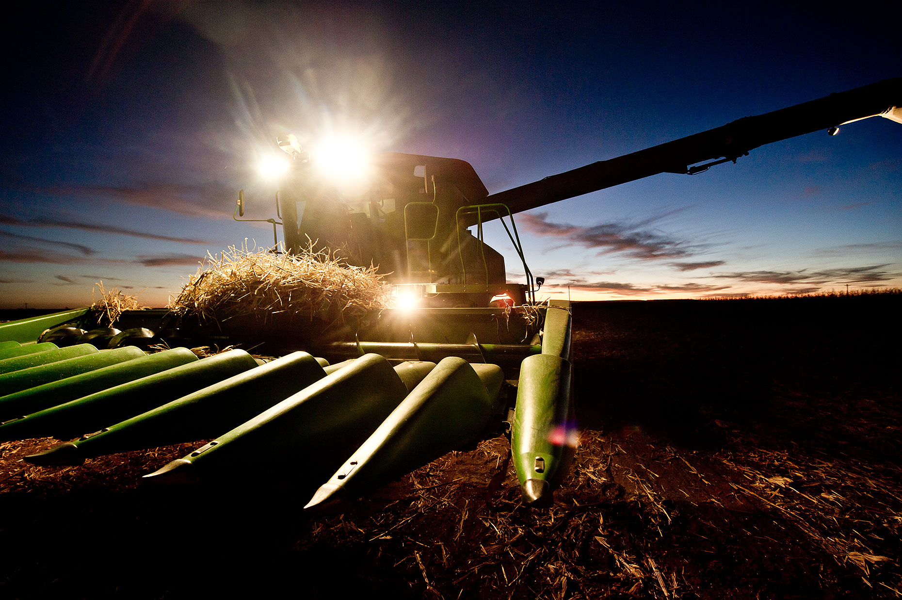 Combine at Sunset during Harvest