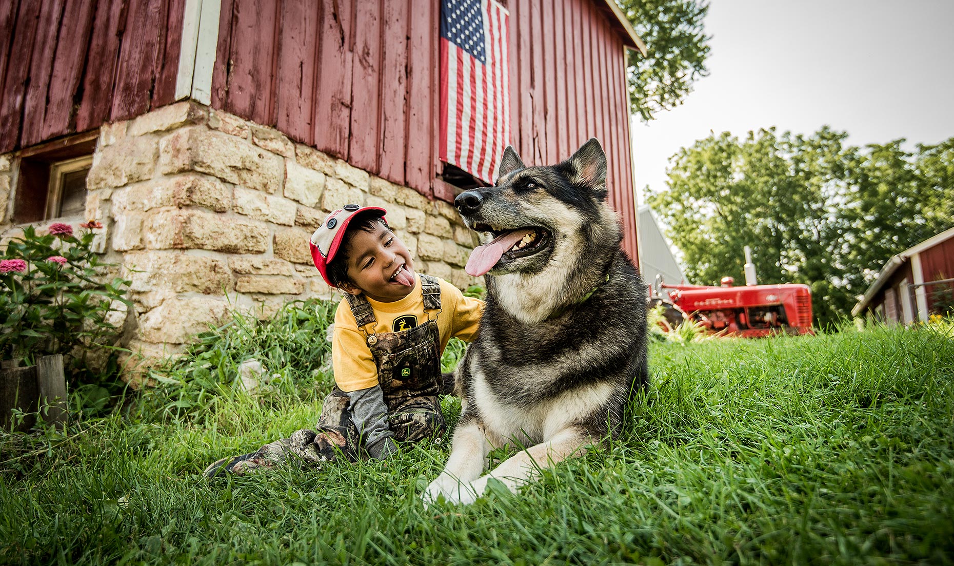 Boy with Dog on Farm