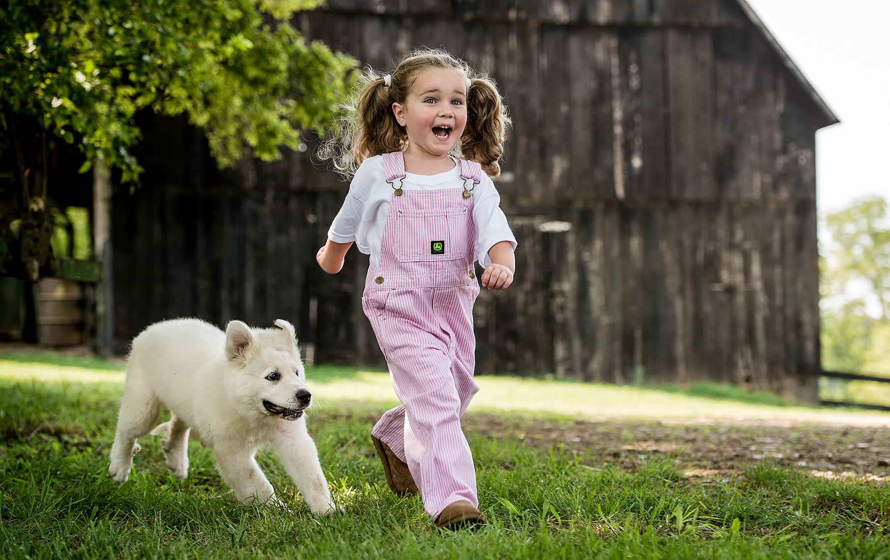 Young Girl with White Dog