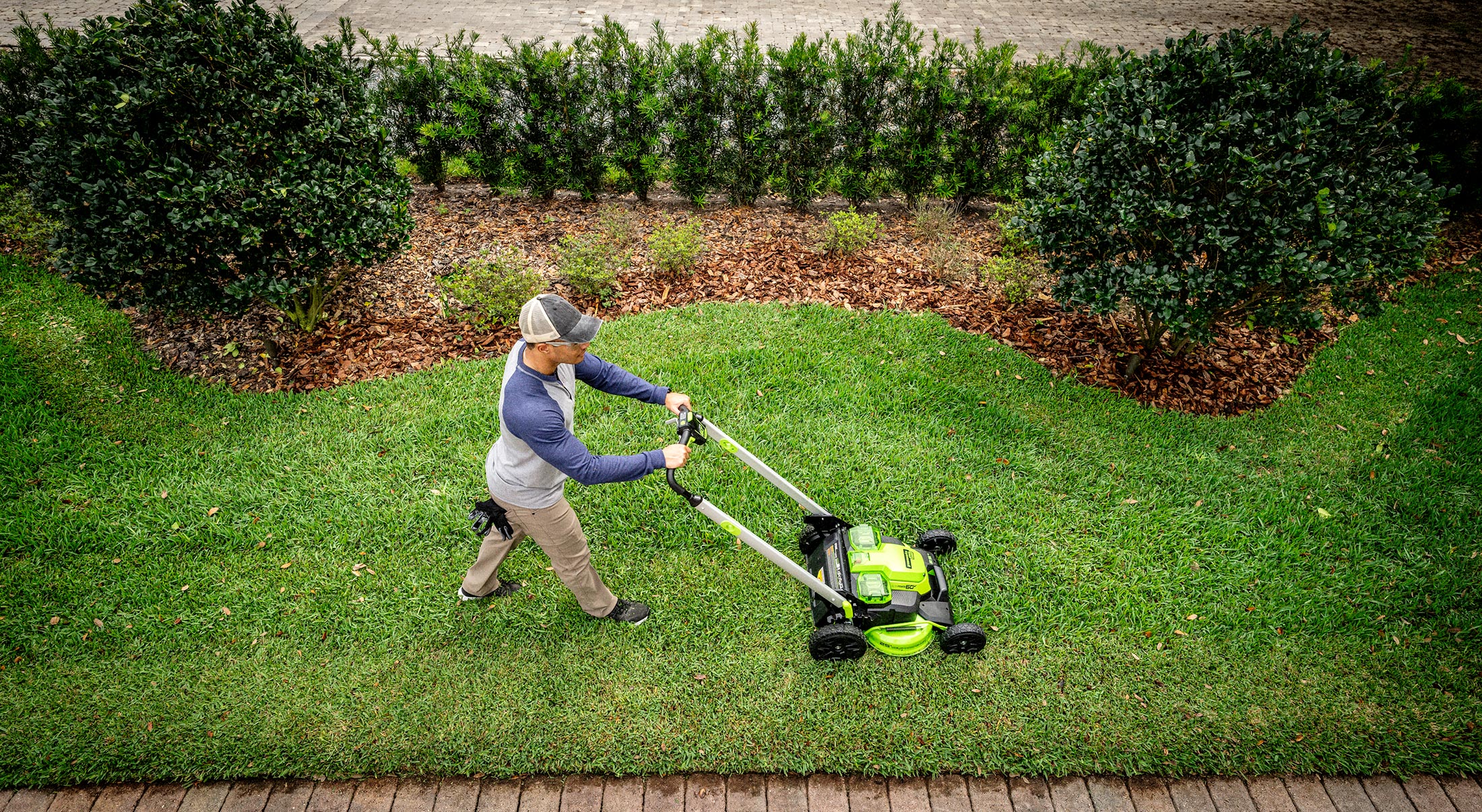 Man Mowing with Landscaping