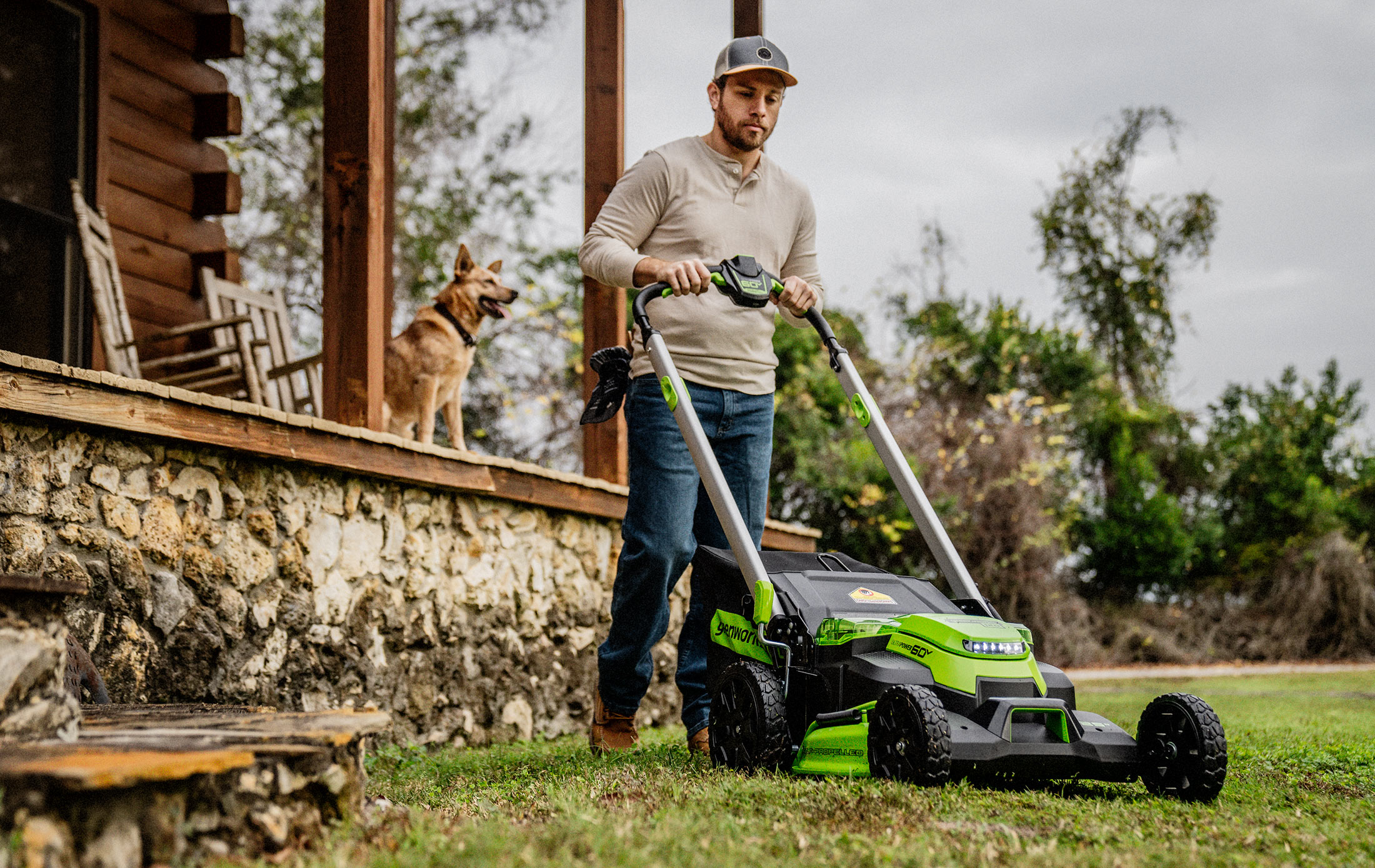 Man Mowing with Dog on Porch