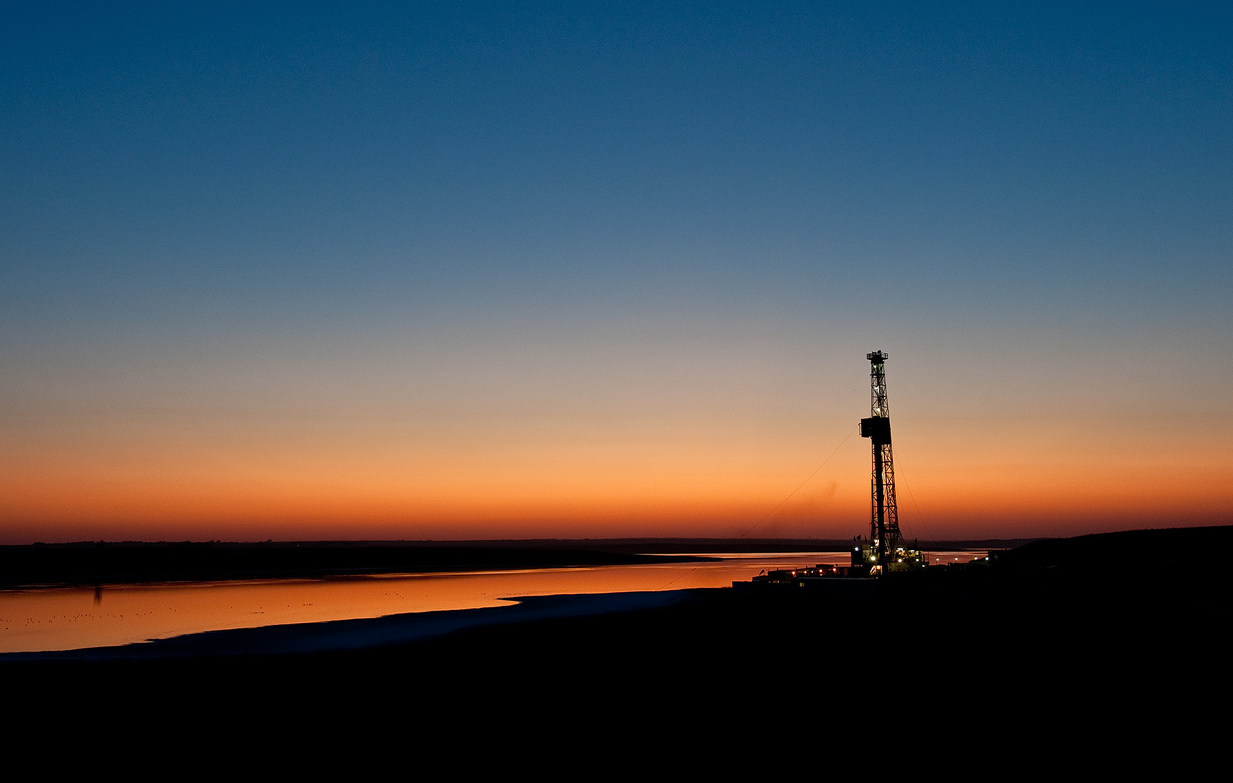Oil Rig at Sunset Photograph