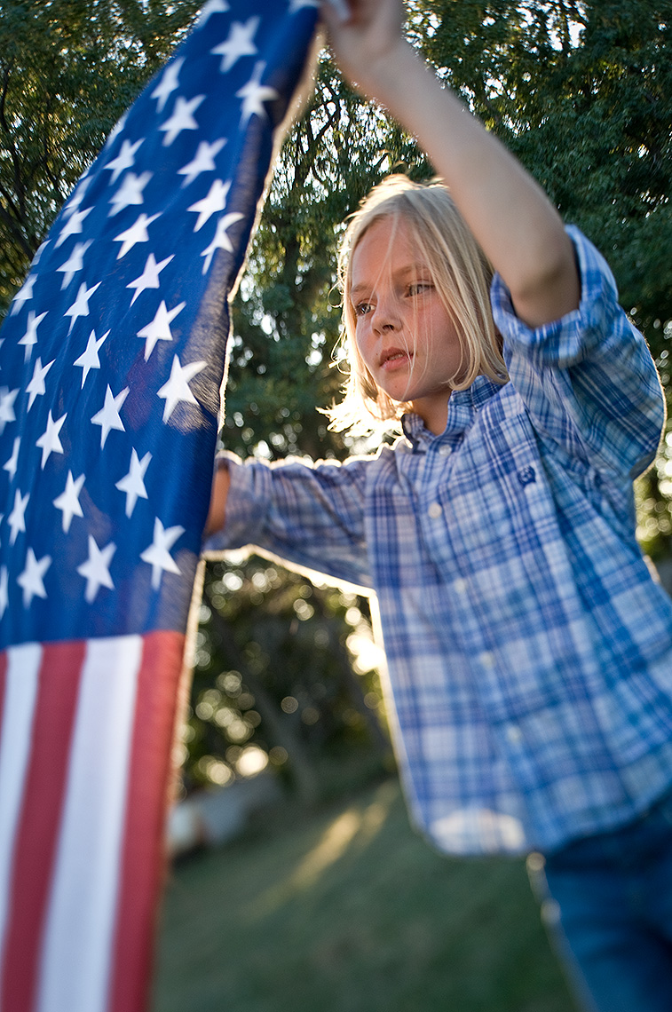 Young Girl and American Flag Photograph