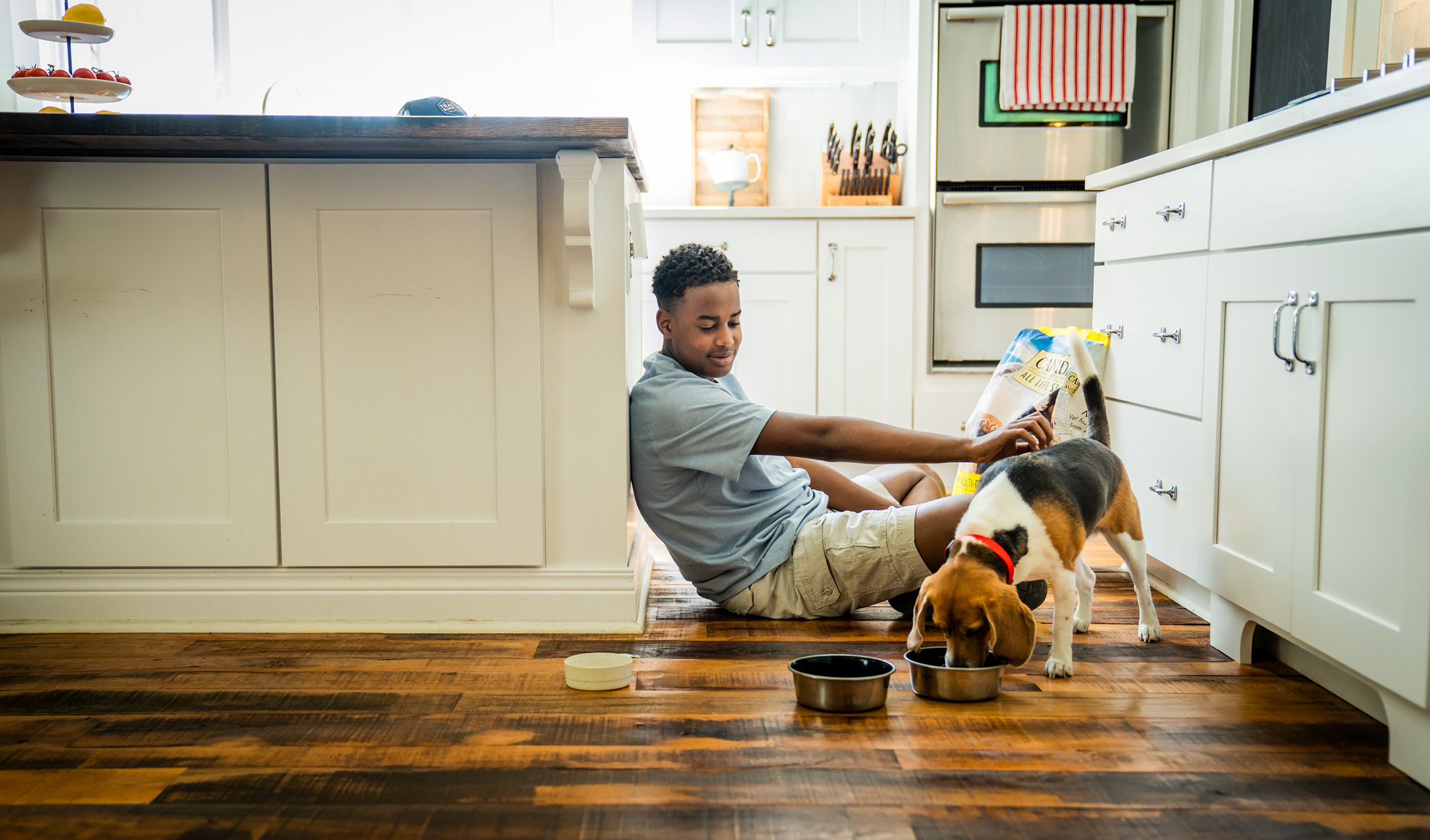 Dog and Teen in Kitchen
