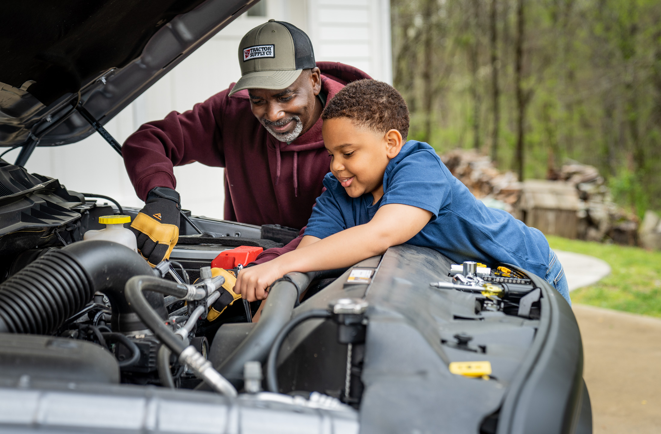 Grandpa and Grandson Fixing Truck