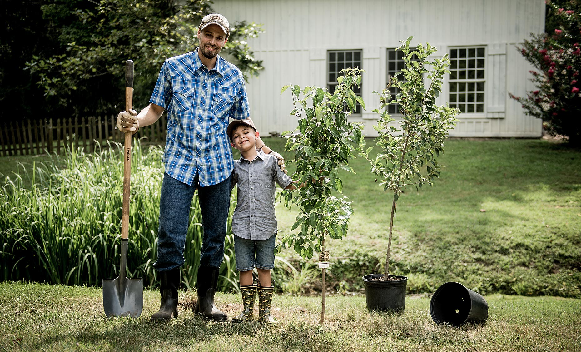 Father and Son Planting Trees
